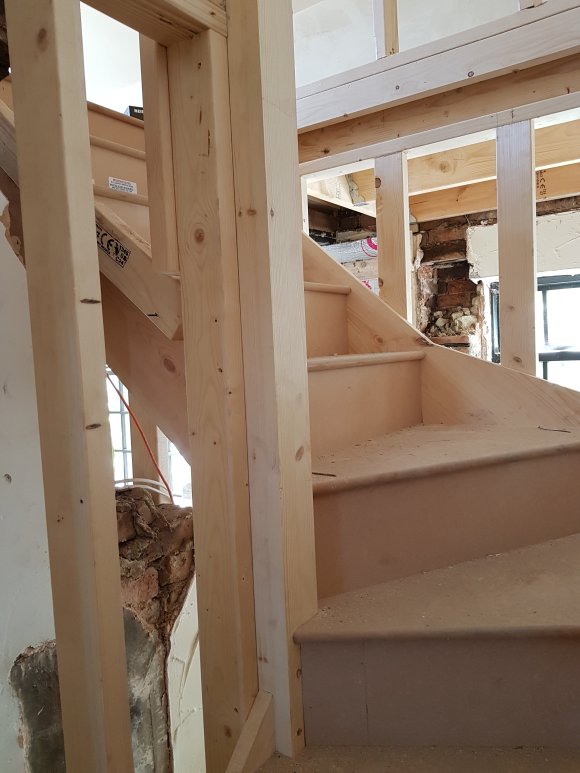 Second floor stairs with a bend to improve climb angle